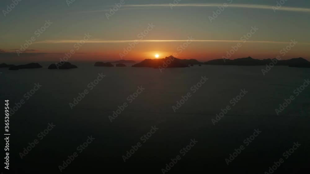aerial view tropical sunset over the sea background of mountains. El nido, Philippines, Palawan. seascape with tropical islands at sunset time. Summer and travel vacation concept aerial view tropical sunset over the sea background of mountains. El nido, Philippines, Palawan. seascape with tropical islands at sunset time. Summer and travel vacation concept