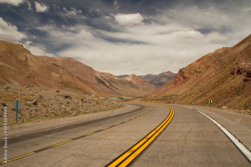 Getaway. Traveling along the desert asphalt road in the arid mountains. 