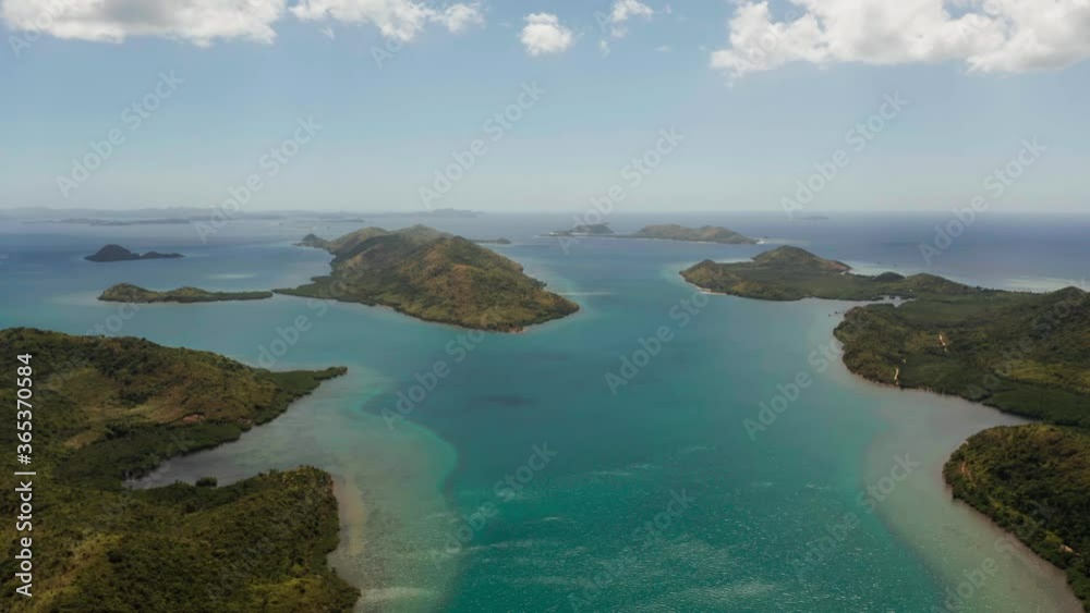 Aerial drone small island group in province of Palawan. Busuanga, Philippines. Seascape, islands covered with forest, sea with blue water. tropical landscape, travel concept Aerial drone small island group in province of Palawan. Busuanga, Philippines. Seascape, islands covered with forest, sea with blue water. tropical landscape, travel concept
