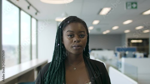 Creative and innovative. A black tech-savvy woman in the workforce. Shot in slow-motion and in 4k.  photo