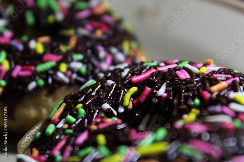 Baked chocolate doughnuts with chocolate glaze. toning. selective focus