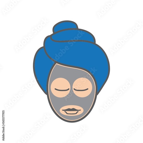 woman at spa with facial mask