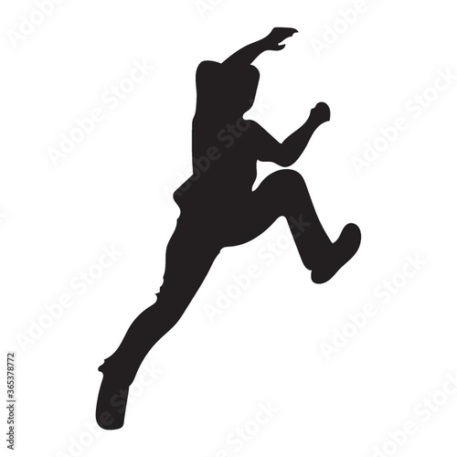 silhouette of man climbing