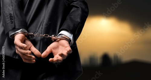 Criminal man with his hands in handcuffs © BillionPhotos.com