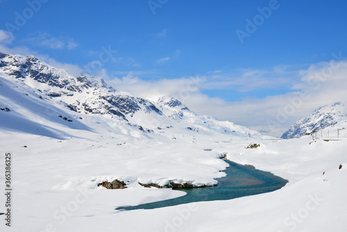 View of snow mountain along Bernina Express train near Ospizio Bernina © Parichat