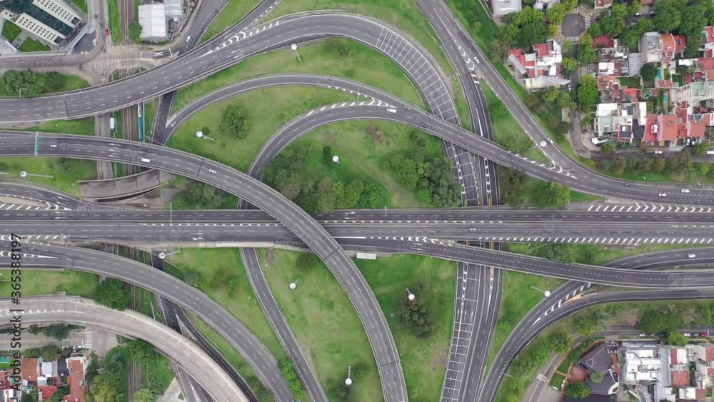 Aerial top down view of a highway interchange with a few cars during Coronavirus pandemic Aerial top down view of a highway interchange with a few cars during Coronavirus pandemic