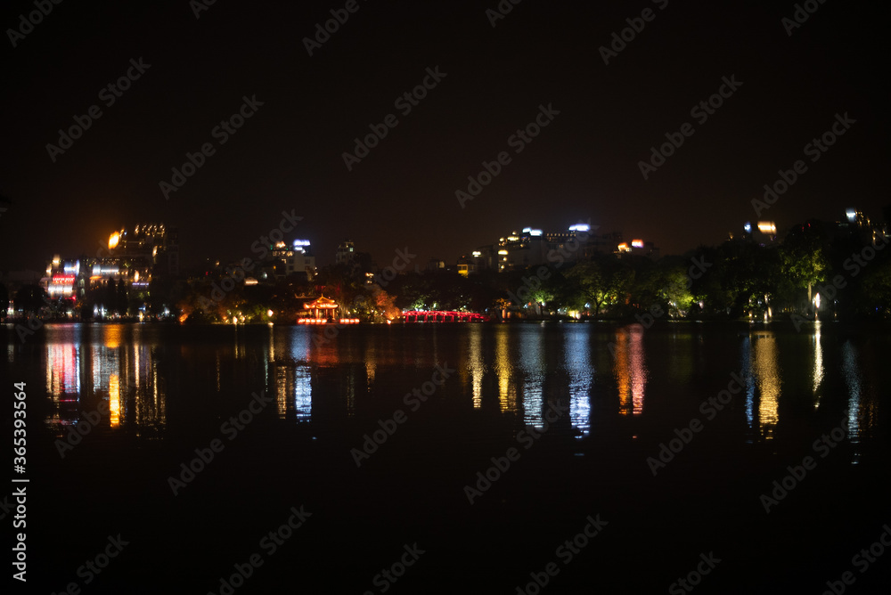 Lights reflecting off lake in Hanoi, Vietnam