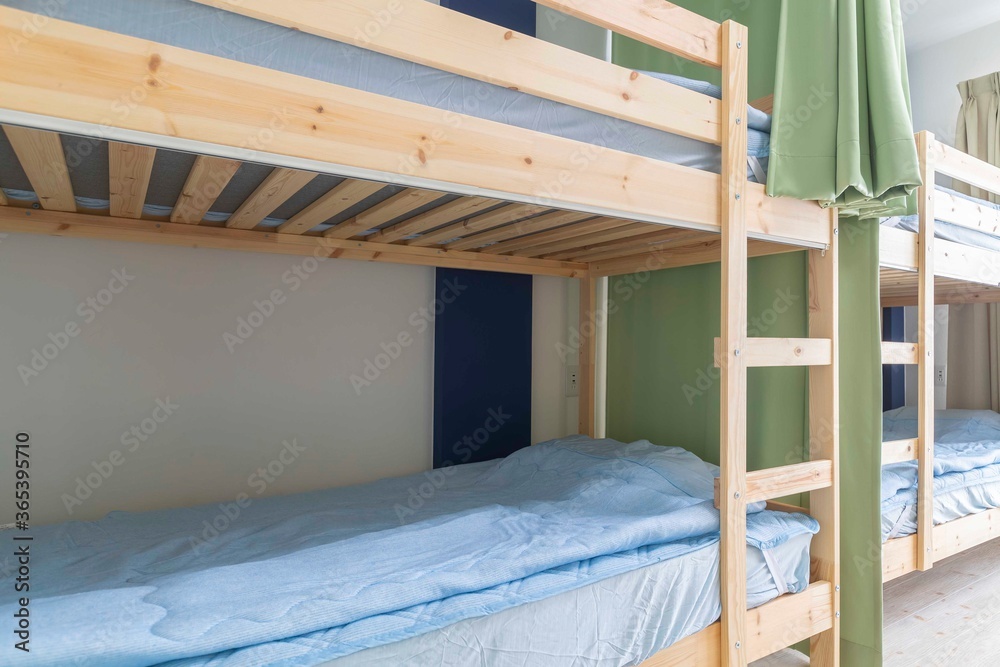 Close - up Bunk bed and mattress in guest house room Close - up Bunk bed and mattress in guest house room