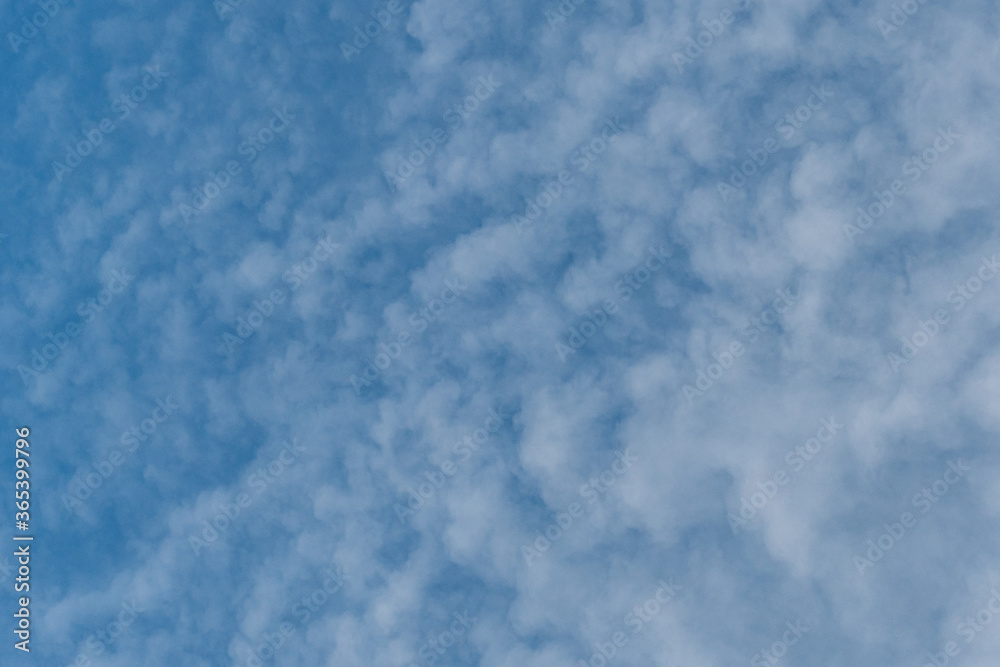 background texture of thin layer of cloud covering the blue sky