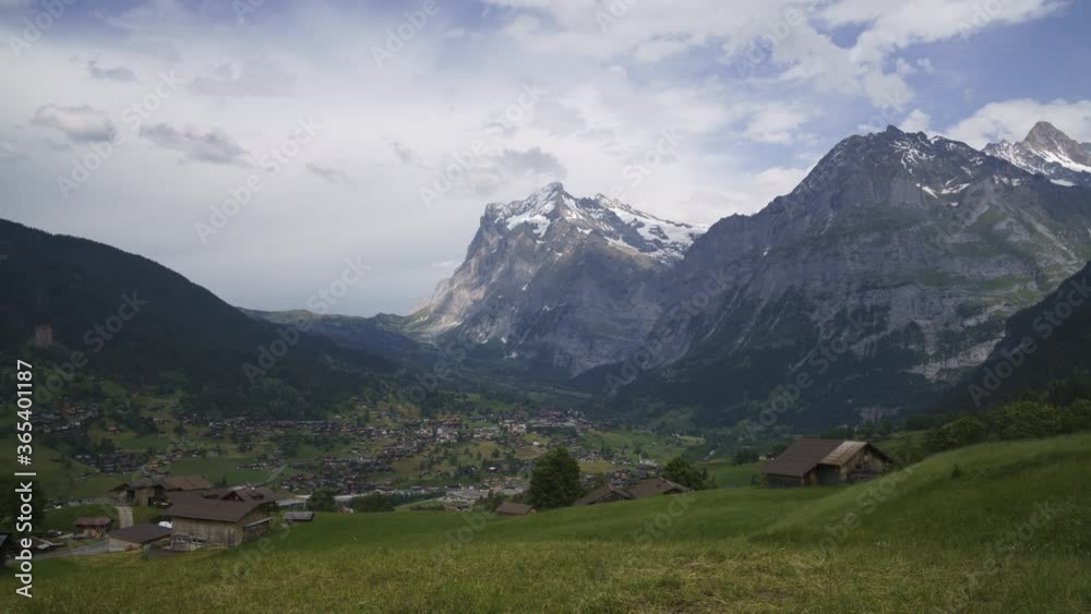 Beautiful Village Of Grindelwald With A View Of Wetterhorn, Mattenberg, And Schreckhorn Mountain In The Canton Of Berne, Switzerland. - wide shot Beautiful Village Of Grindelwald With A View Of Wetterhorn, Mattenberg, And Schreckhorn Mountain In The Canton Of Berne, Switzerland. - wide shot