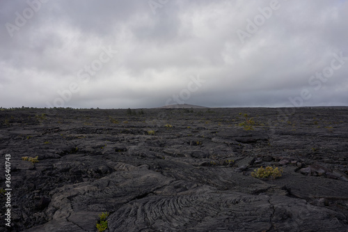 Clouds darken and gather over lava fields in Hawaii Volcanoes National Park on the Big Island.