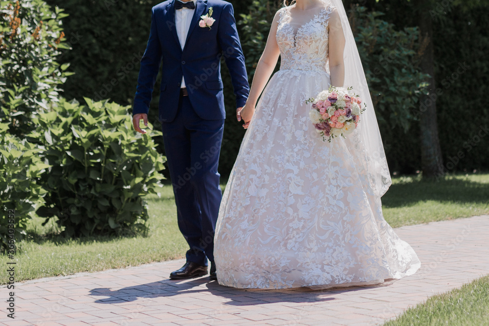 groom with bride together in summer park