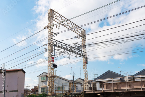 The railway power cables on local train railway track in Japan. © ChomchoeiFoto