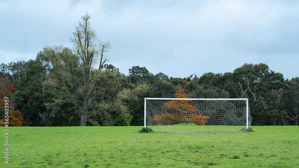 Soccer goal posts in front of trees at Yarra Bend Park in Melbourne, Australia