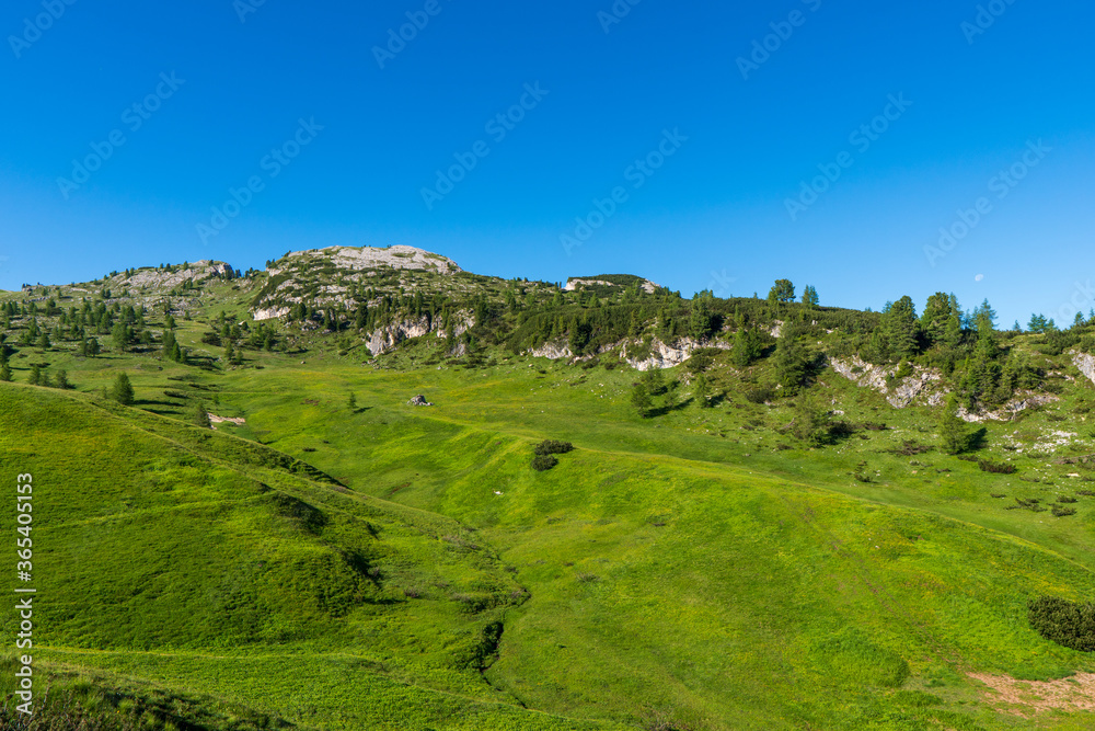 Pass Falzarego in spring. Picturesque valley among the Dolomites. The majestic Alps. Trentino Alto Adige, Italy