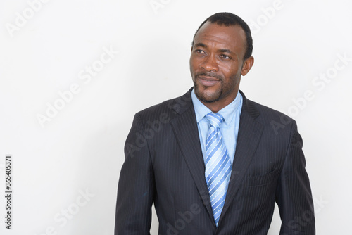 Portrait of handsome bearded African businessman in suit
