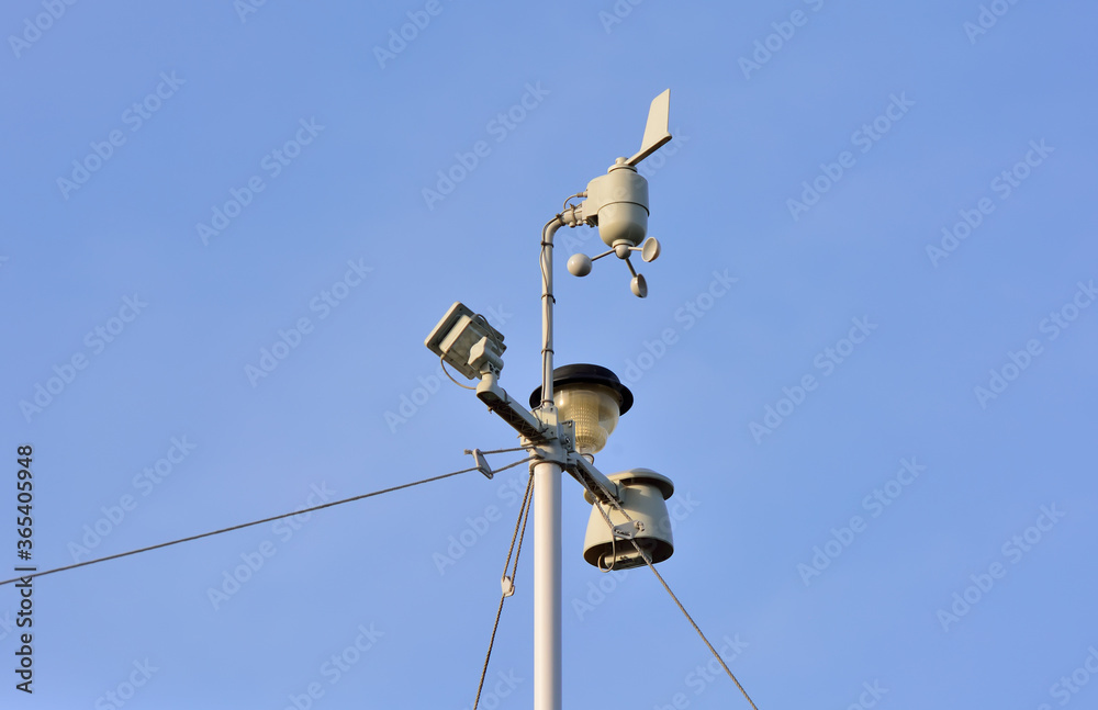 Devices meteorological station on the blue background of the sky Devices meteorological station on the blue background of the sky