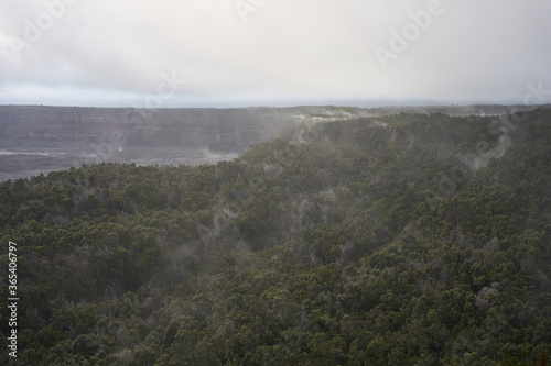 Kīlauea caldera and its surrounding tropical rainforest seen from Volcano House Overlook at dusk in Hawaii Volcanoes National Park on the Big Island, on November 26, 2019. © Tada Images