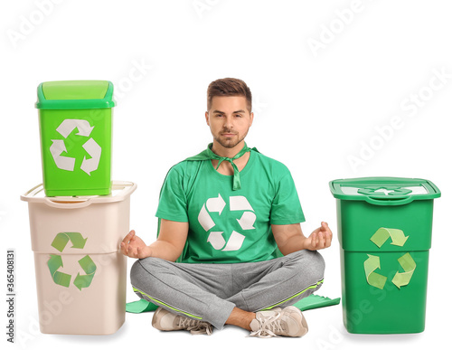 Meditating man dressed as e...