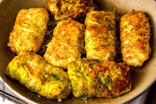 Boiled cabbage rolls covered with breadcrumbs with spices
