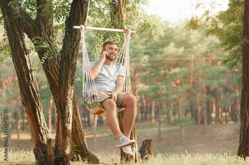 Young man with mobile phone...