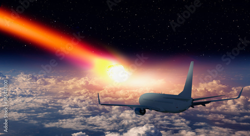 Attack of the asteroid (meteor) on the Earth with airplane in the sky "Elements of this image furnished by NASA