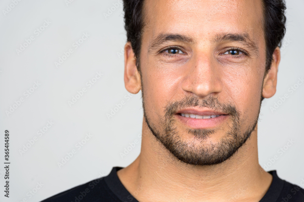 Portrait of handsome bearded Hispanic man with curly hair Portrait of handsome bearded Hispanic man with curly hair