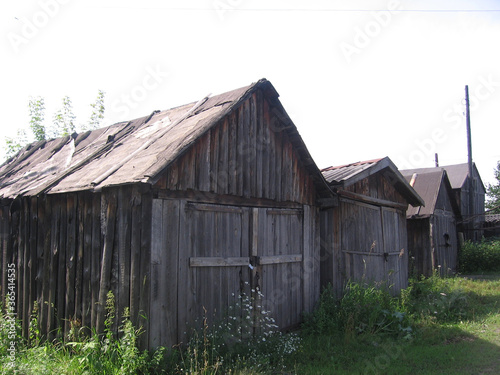 old wooden buildings buildings for storing supplies in the barn houses © Алла Мосурова