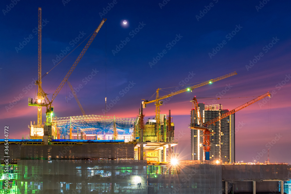 Construction site busy operate in beginning of building new complex infrastructure project at twilight time. Construction site busy operate in beginning of building new complex infrastructure project at twilight time.