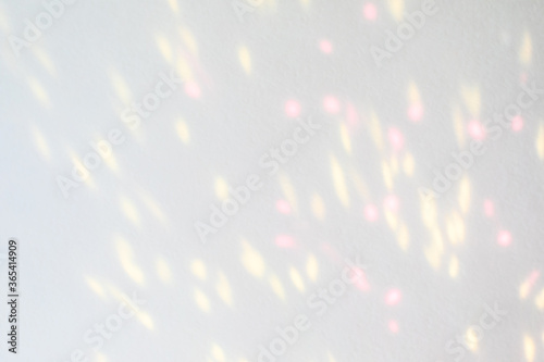 Blurred overlay effect for photo and mockups. Wall texture with organic drop diagonal shadow and rays of light on a white wall. shadows for natural light effects