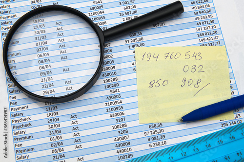 business office desk closeup - financial reports  analysis and accounting  set of documents  tables and graphs  various items for bookkeeping  calculator