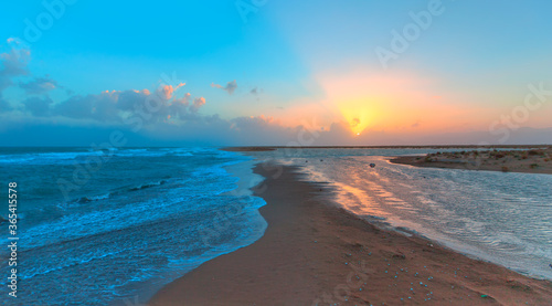 Double sided beach and sea wave at sunset - Mersin, Turkey