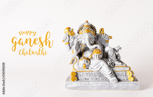 Obraz na plátně Happy Ganesh Chaturthi festival, Lord Ganesha statue with beautiful texture on white background, Ganesh is hindu god of Success