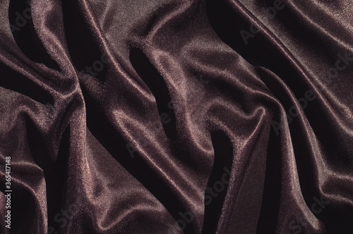 Smooth elegant brown silk or satin texture can use as abstract background