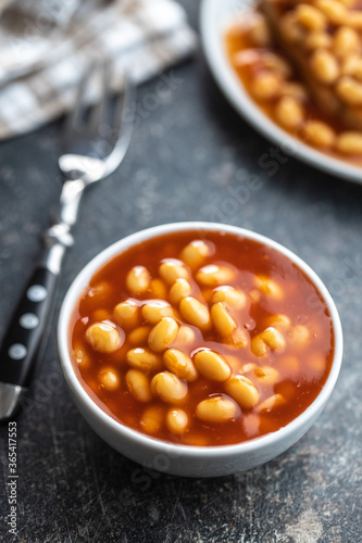Baked beans in bowl. Beans with tomato sauce