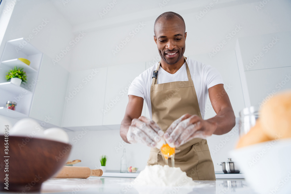 Portrait of his he nice attractive cheerful cheery guy professional confectioner making fresh bread pide boat national culinary in modern light white interior house kitchen