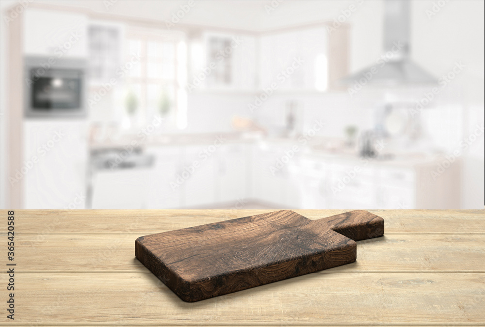 wooden table top with cutting board in front of blurred kitchen - 3D Illustration