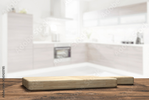wooden table top with cutting board in front of blurred kitchen - 3D Illustration