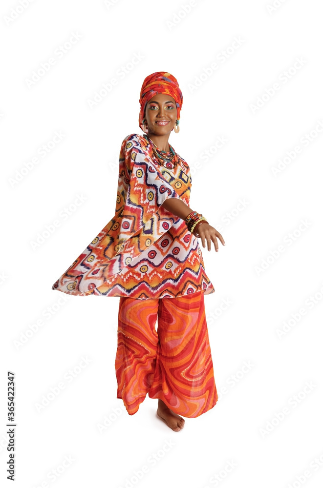 Beauty African American woman in traditional clothes dancing in the studio