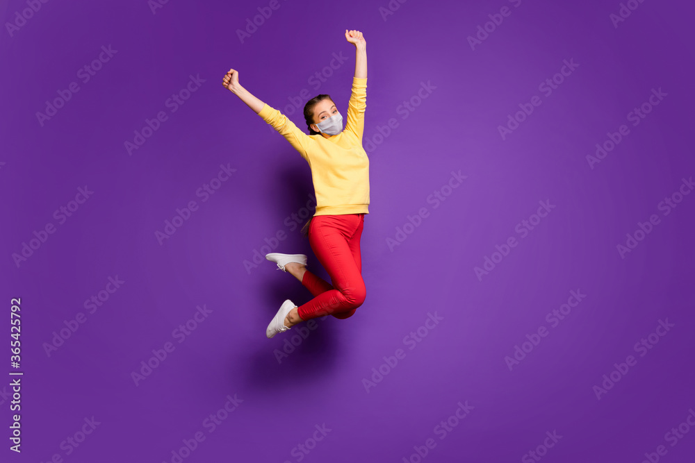 Full length body size view of her she worried girl wearing safety mask jumping rising hands up stop mers cov recovery isolated bright vivid shine vibrant violet purple lilac color background