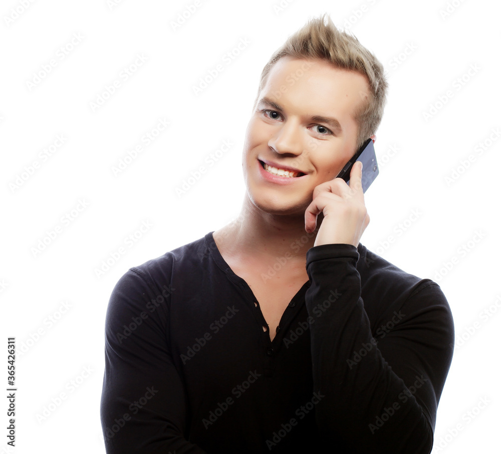 smiling man walking and talking on cell phone smiling man walking and talking on cell phone