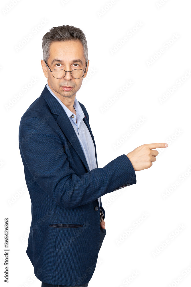 Man in glasses is pointing away, looking at camera. Isolated white background Man in glasses is pointing away, looking at camera. Isolated white background