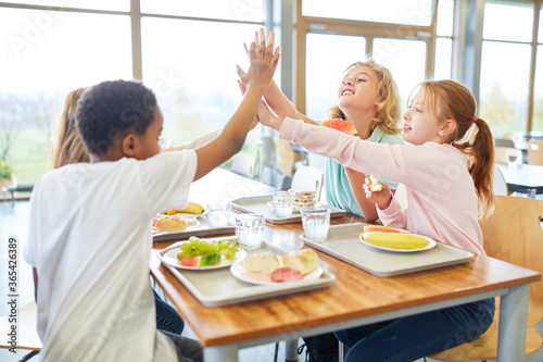 Kids have fun together in the canteen