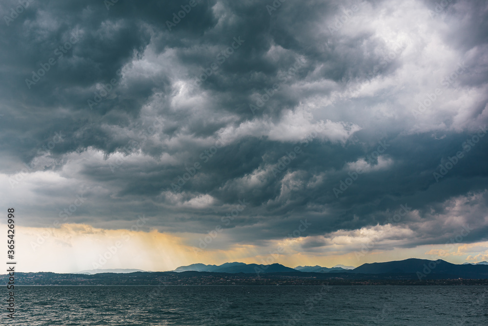 Amazing stormy sky over the lake Garda, Italy.
