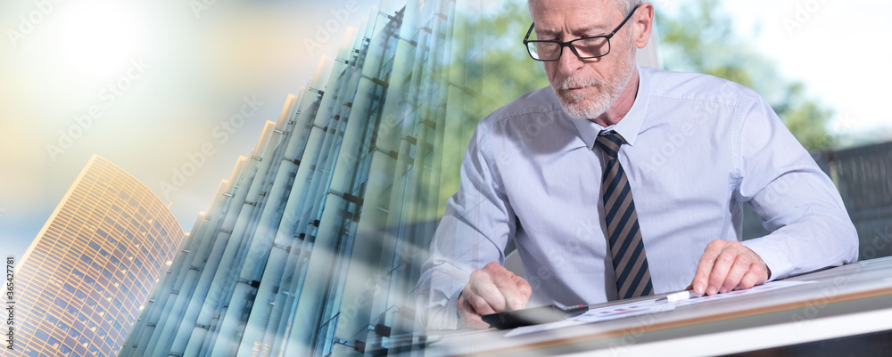 Accountant working on financial documents; multiple exposure Accountant working on financial documents; multiple exposure