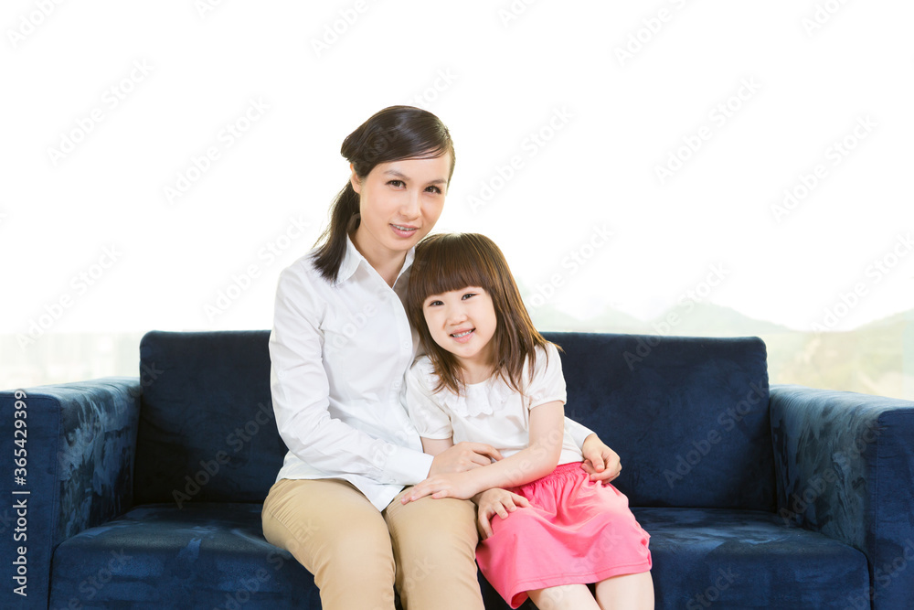 Portrait of mother and daughter at home