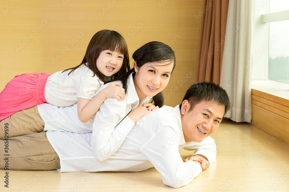 Happy family smiling together at home Happy family smiling together at home