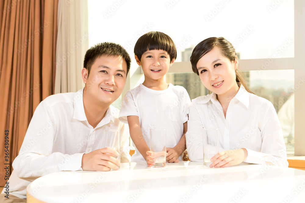 Happy family  smiling together at home