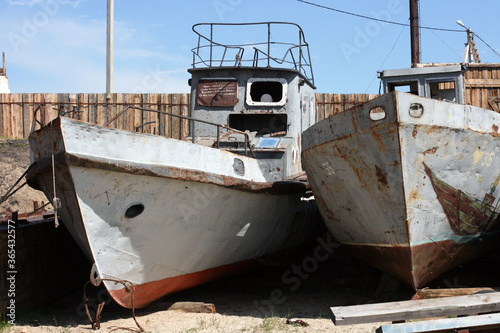 Olkhon / Russia - June 27, 2019: Excursion boats on the shore of the Baikal lake. Lake Baikal. The deepest lake on the planet. Fresh reservoir. 