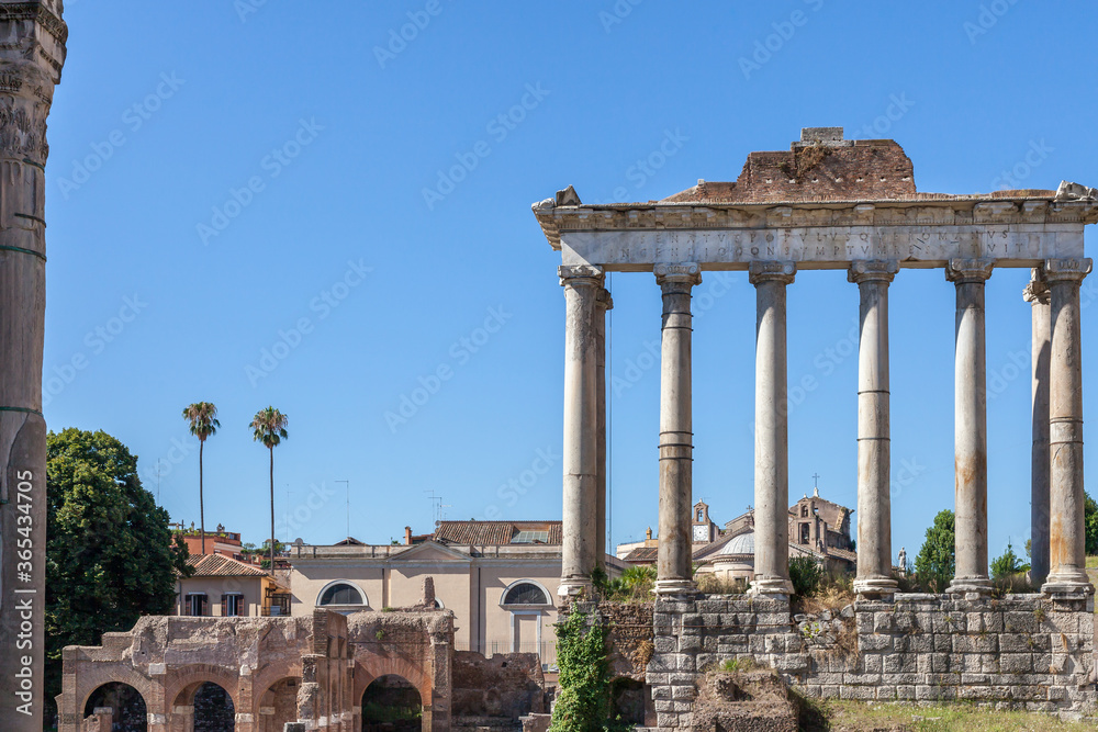 ROME, ITALY - 2014 AUGUST 18. Roman ruins with cityscape of Rome.